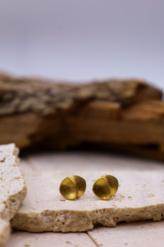 Goldene Ohrringe Muse