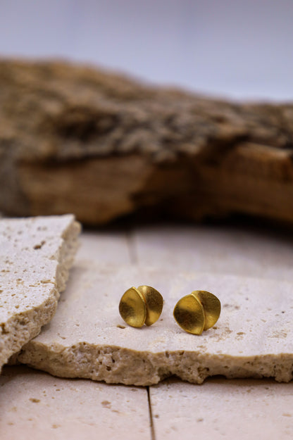 Goldene Ohrringe Muse